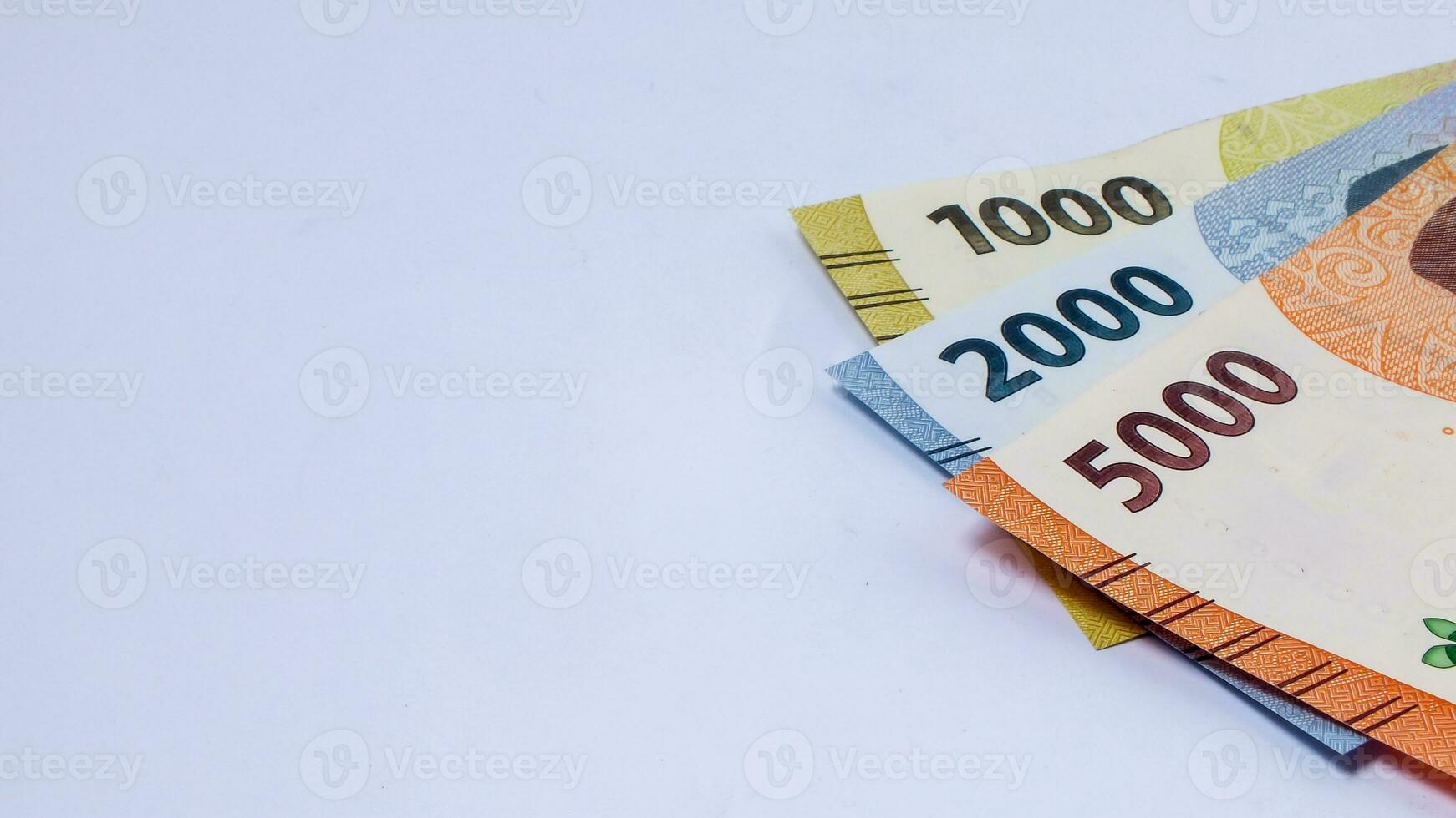 collection of Indonesian rupiah banknotes on a white background photo