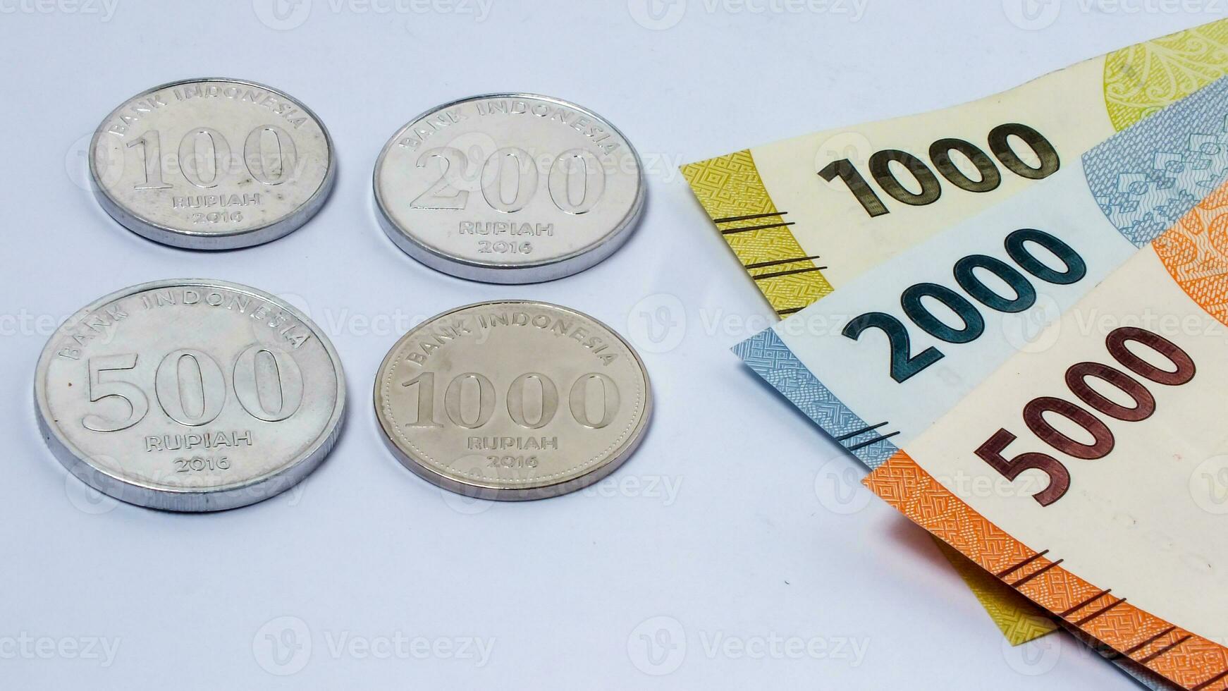 collection of Indonesian rupiah banknotes on a white background photo