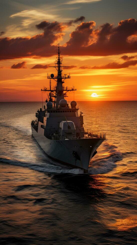 Sunset over a navy ship on the open sea photo