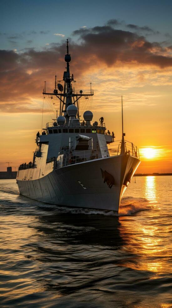 Sunset over a navy ship on the open sea photo