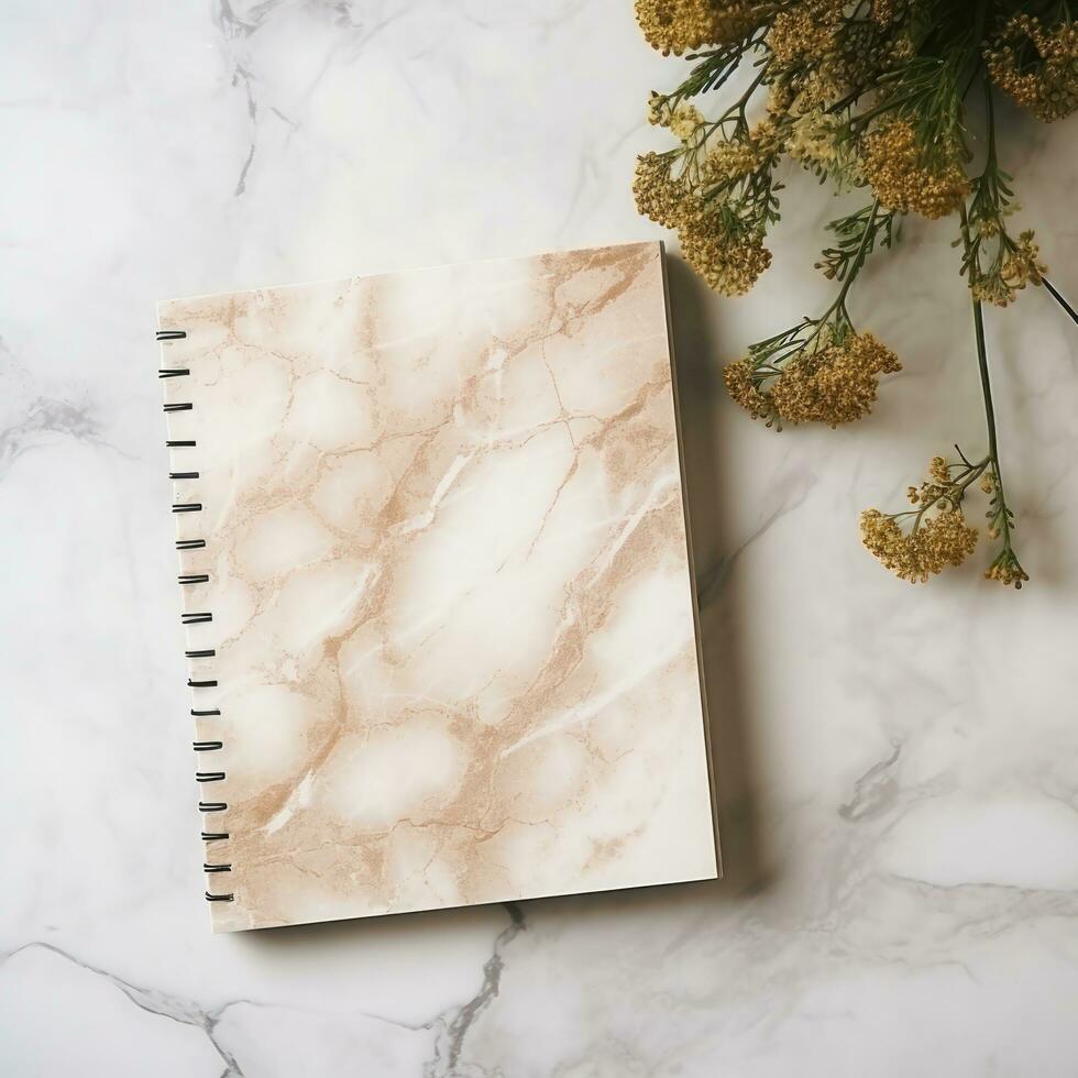 white and square notebook on a marble background photo