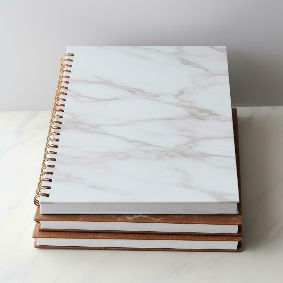 white and square notebook on a marble background photo