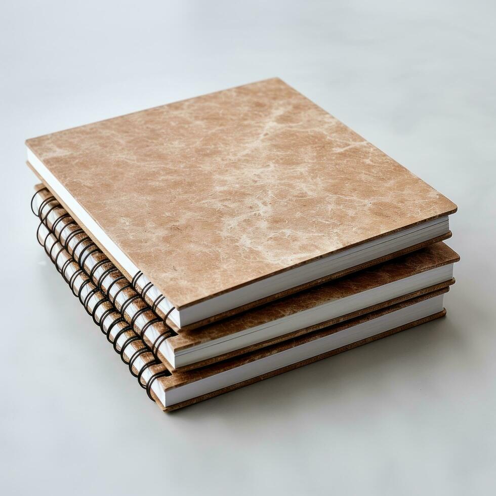 white and square notebook on a marble background photo