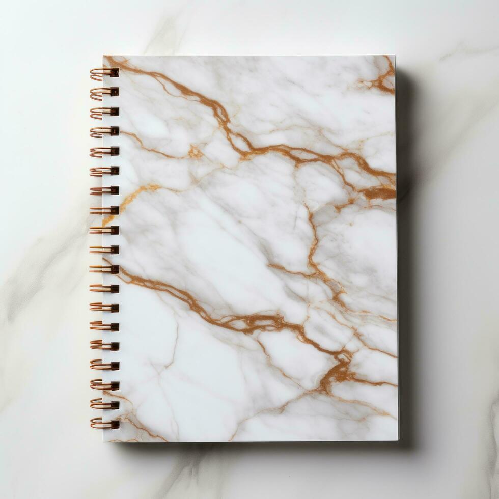 white and square notebook on a marble background photo
