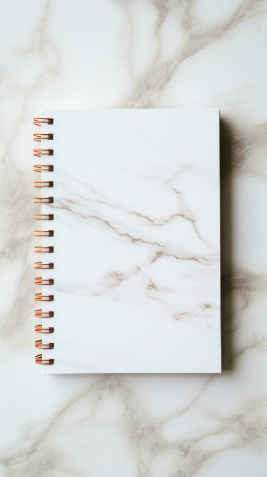 white and square notebook on a marble background photo