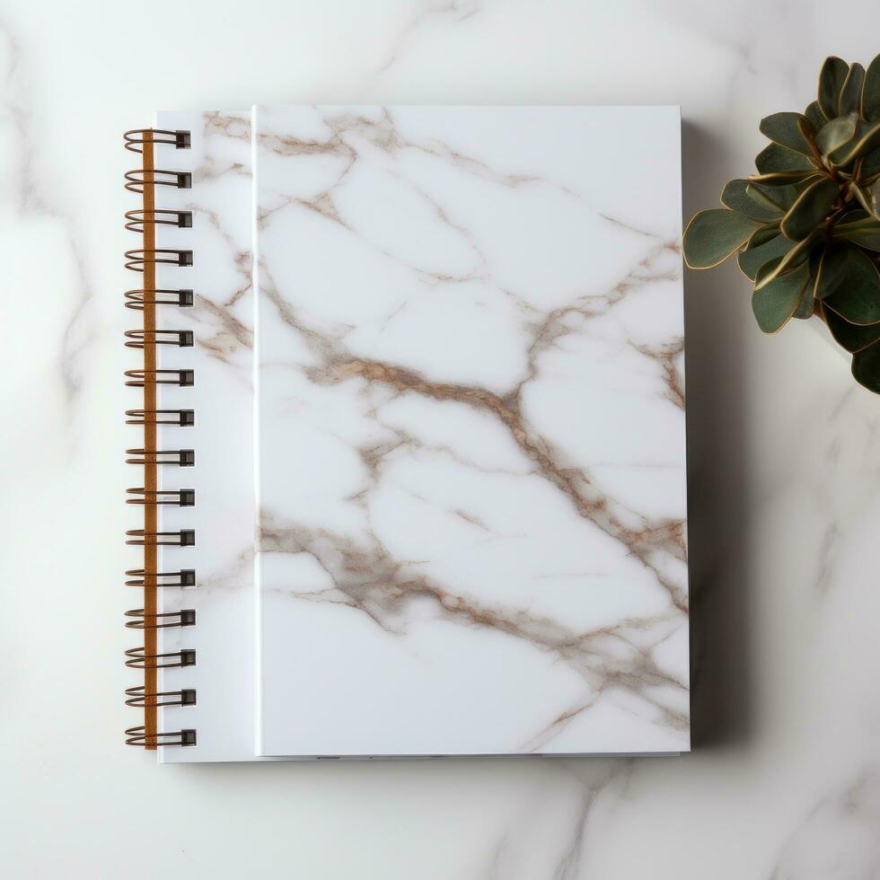 white and square notebook on a marble background photo
