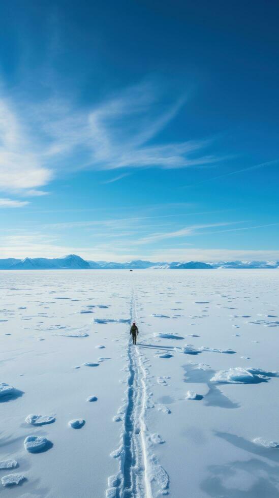 Lone explorer standing on vast ice floe photo