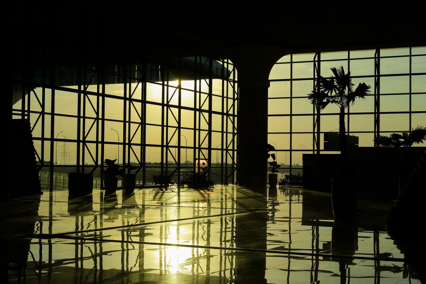The airport silhouette interior during the sunrise. Yogyakarta International Airport YIA is modern facility serving international and domestic flights. Kulon Progo - Indonesia 09 03 2023 photo