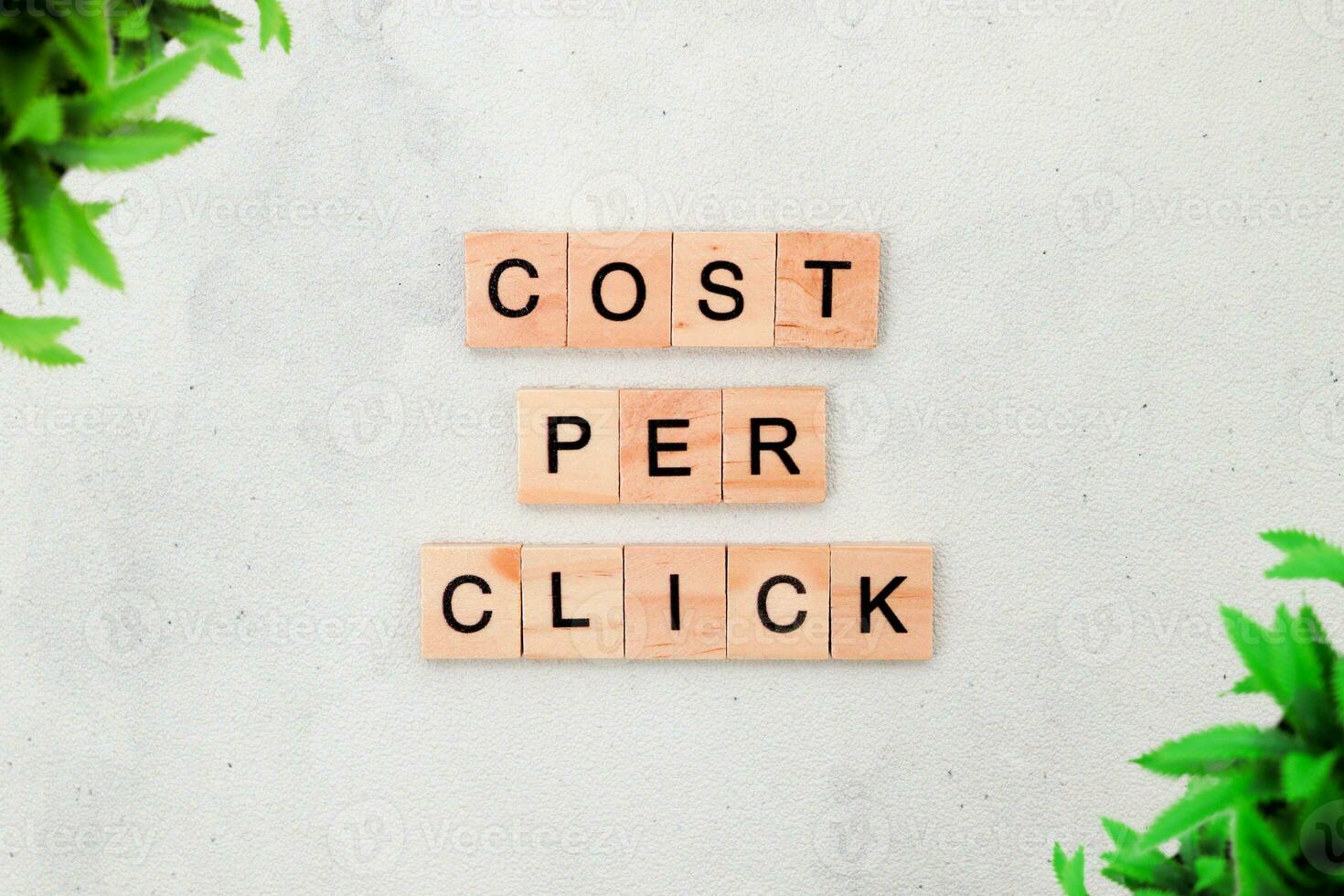 Top view of Cost Per Click word on wooden cube letter block on white background. Business concept photo