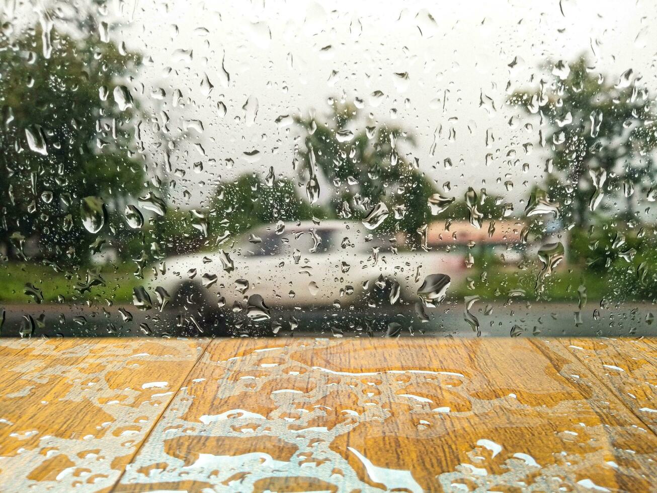 water drops on wooden table  backdrop of water drops on glass  Space to display your products, rainy season, weather photo