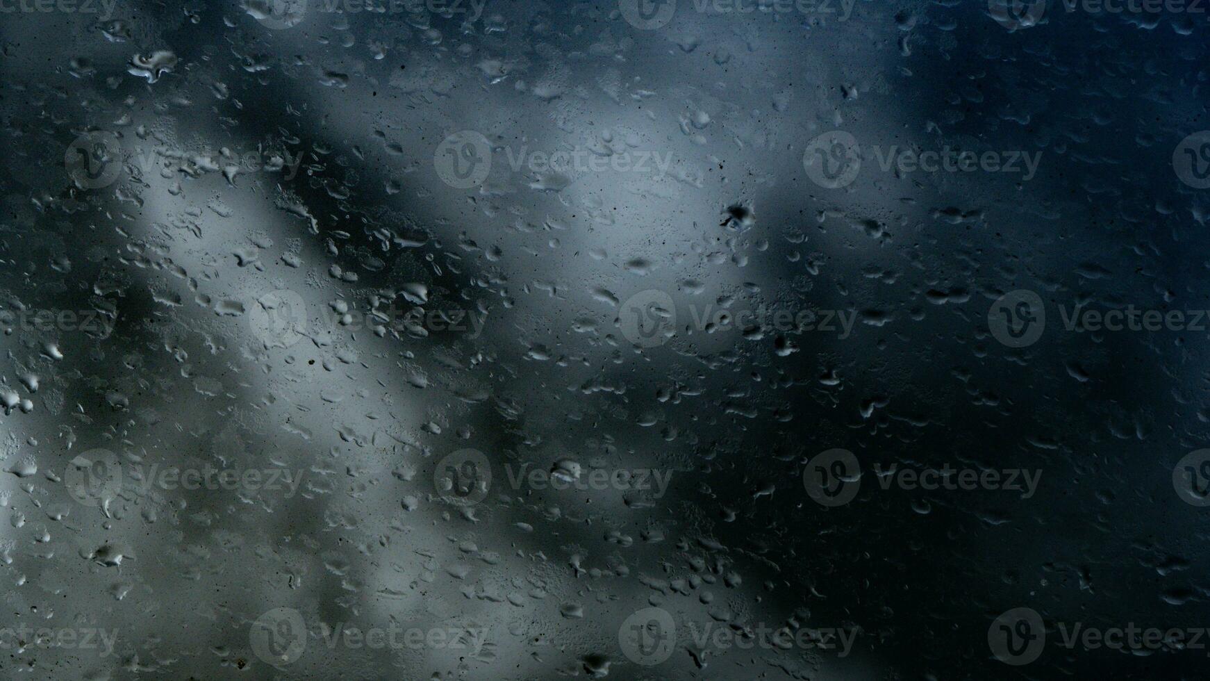 lluvia agua gotas en vaso foto