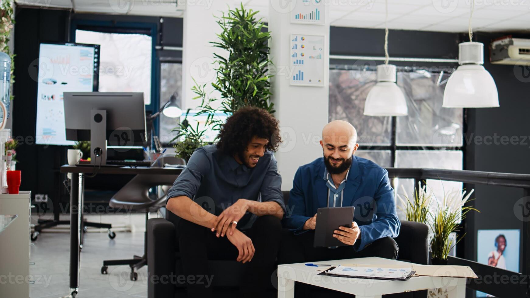 Manager explaining research project, trying to create small business presentation for investment request in coworking space. Startup team collaborating on successful development ideas. photo
