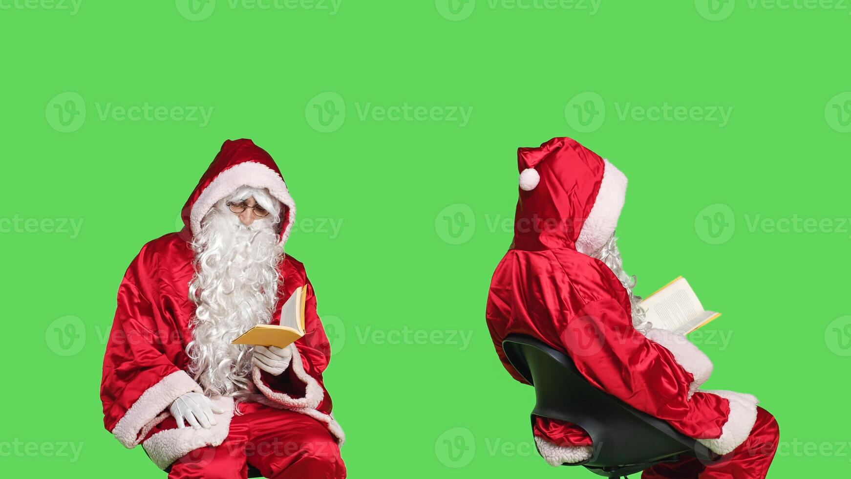 Wise person reading for knowledge, enjoying novel story or fairytale while he sits over greenscreen. Man portraying father christmas reads fiction or poetry, sitting on chair. photo