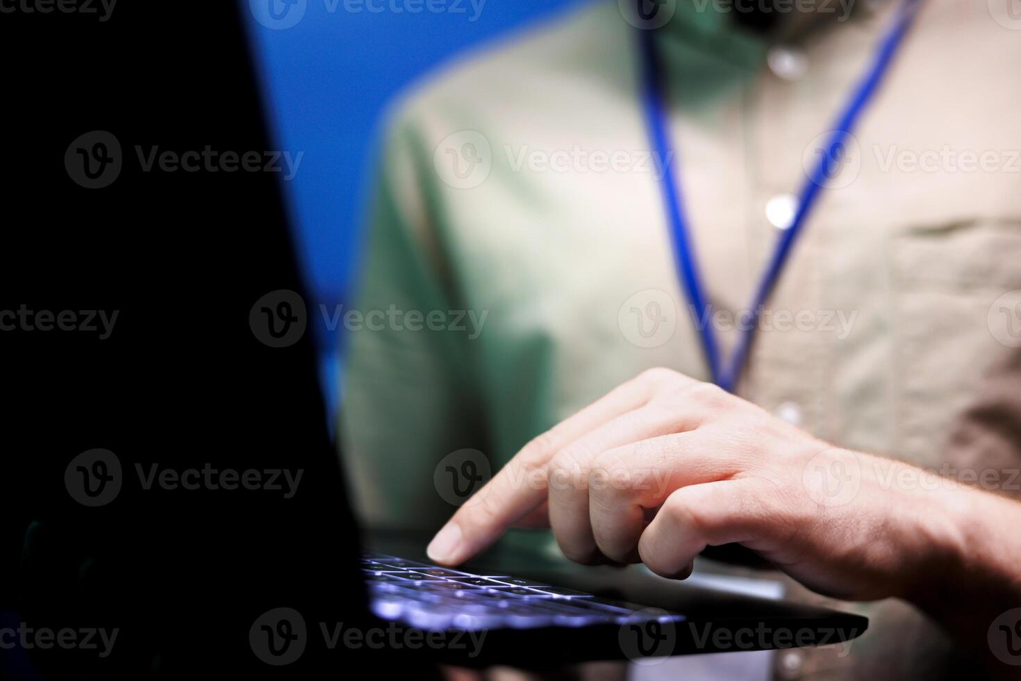 Close up of specialist in high tech facility providing secure, scalable, and reliable infrastructure for storing, processing, and analyzing large datasets generated by artificial intelligence photo