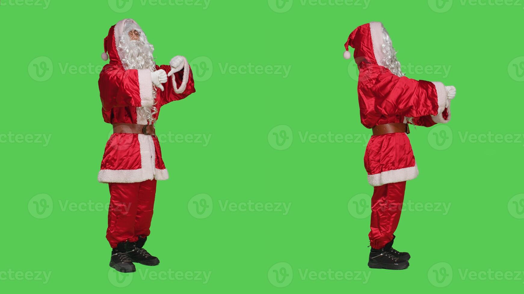 Father christmas gives thumbs down in studio, expressing frustration and disapproval when he should be spreading joyful holiday spirit. Santa claus showing dislike sign, displeased man. photo