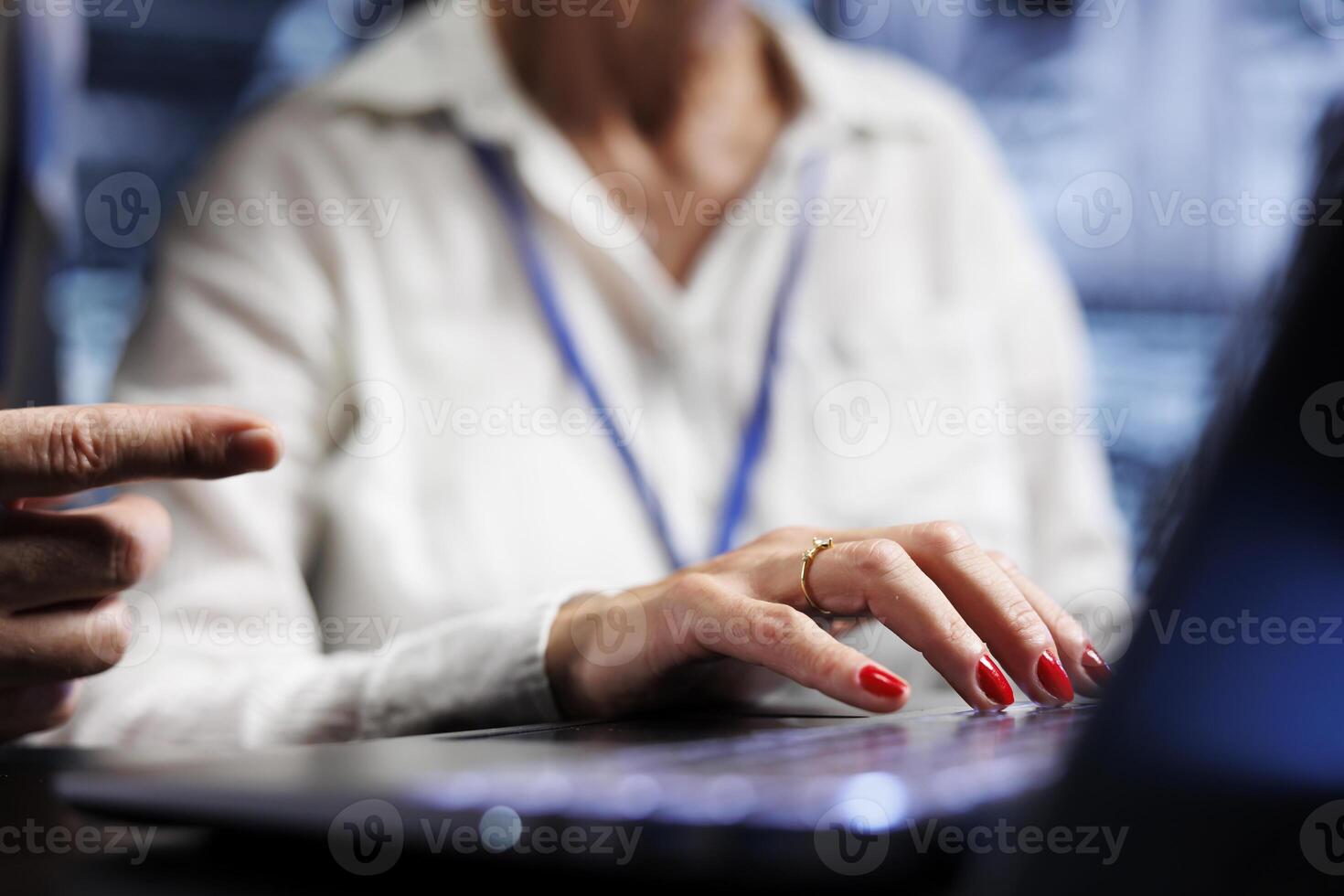 Efficient coworkers dealing with server cabinets system failures. Knowledgeable experts brainstorming ideas on how to best minimize data storage company downtime and prevent malfunctions, close up photo