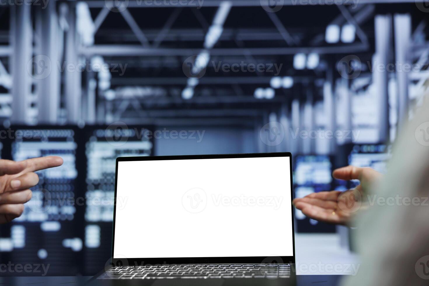 Close up shot of mock up laptop used by competent technician in data center using server rigs to deliver massive computing power, control network resources, process and store datasets photo