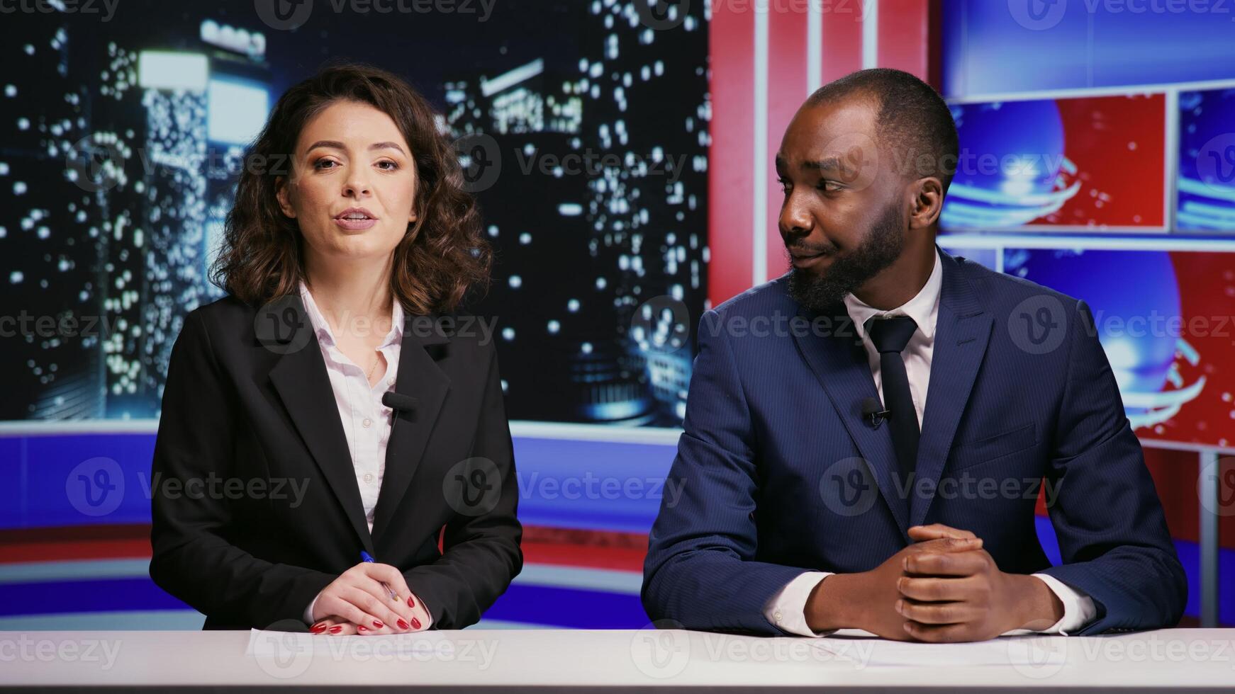 Diverse reporters team on talk show at night, hosting entertainment panel to discuss about latest celebrity news or scandals. Man and woman hosts presenting night show live on tv network. photo