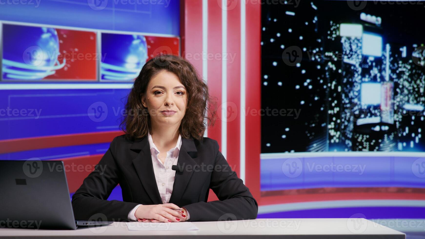 Media reporter presenting news on night show, discussing about latest events on television program in news studio. Woman journalist addressing daily newscast, hosting talk show for entertainment. photo