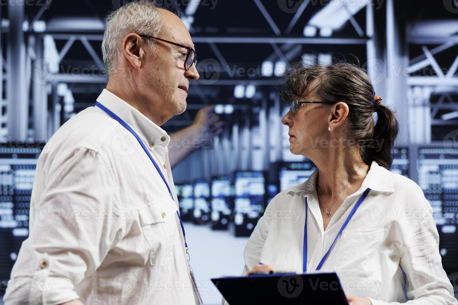 Senescent engineers brainstorming ways to recondition server hub electronics. Master technicians brainstorming ideas on how to best minimize high tech workspace downtime and prevent disruptions photo