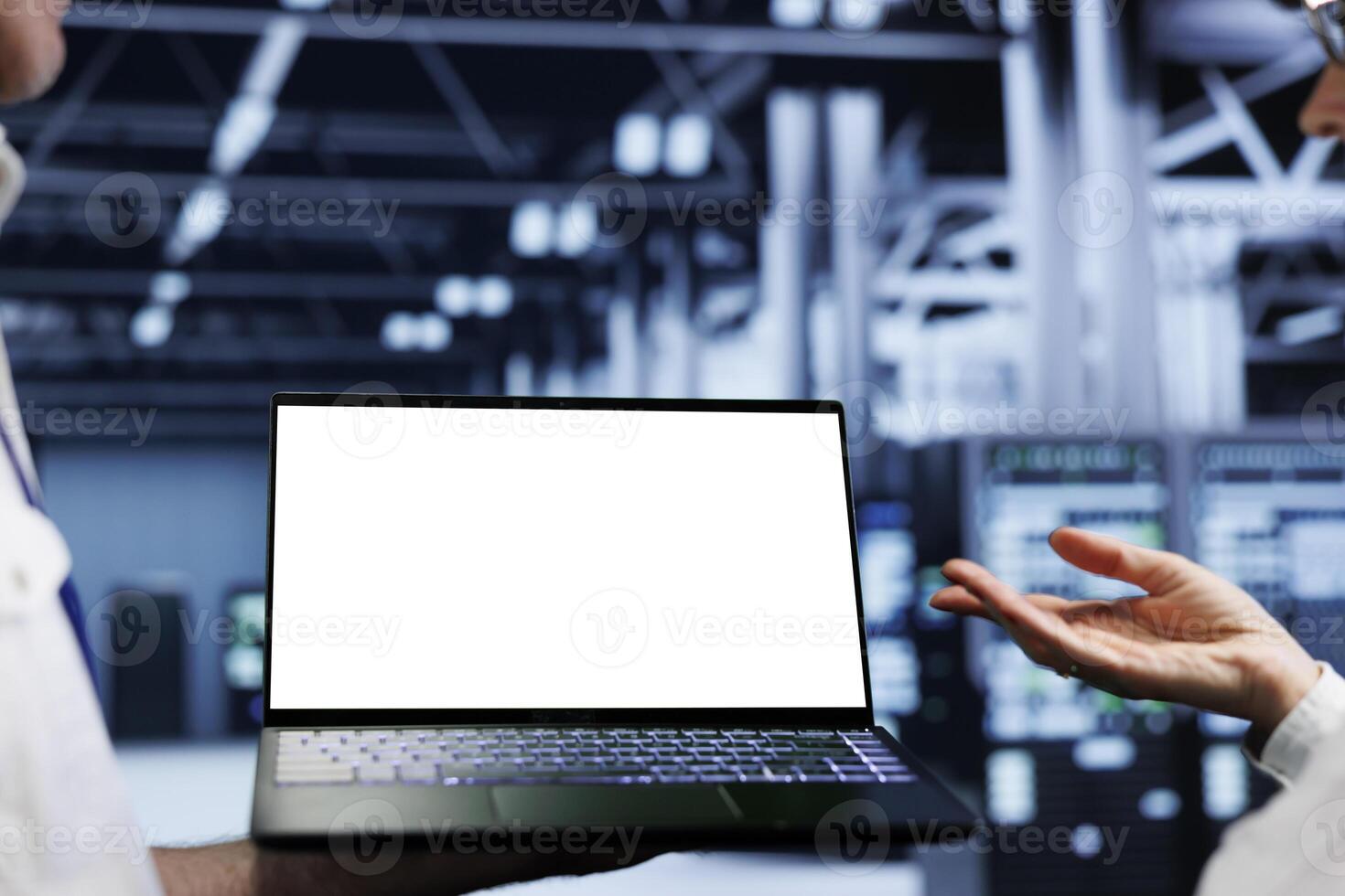 Close up shot of mock up laptop used by precise worker in data center supercomputer room delivering massive computing power, capable of processing and storing vast amounts of datasets photo