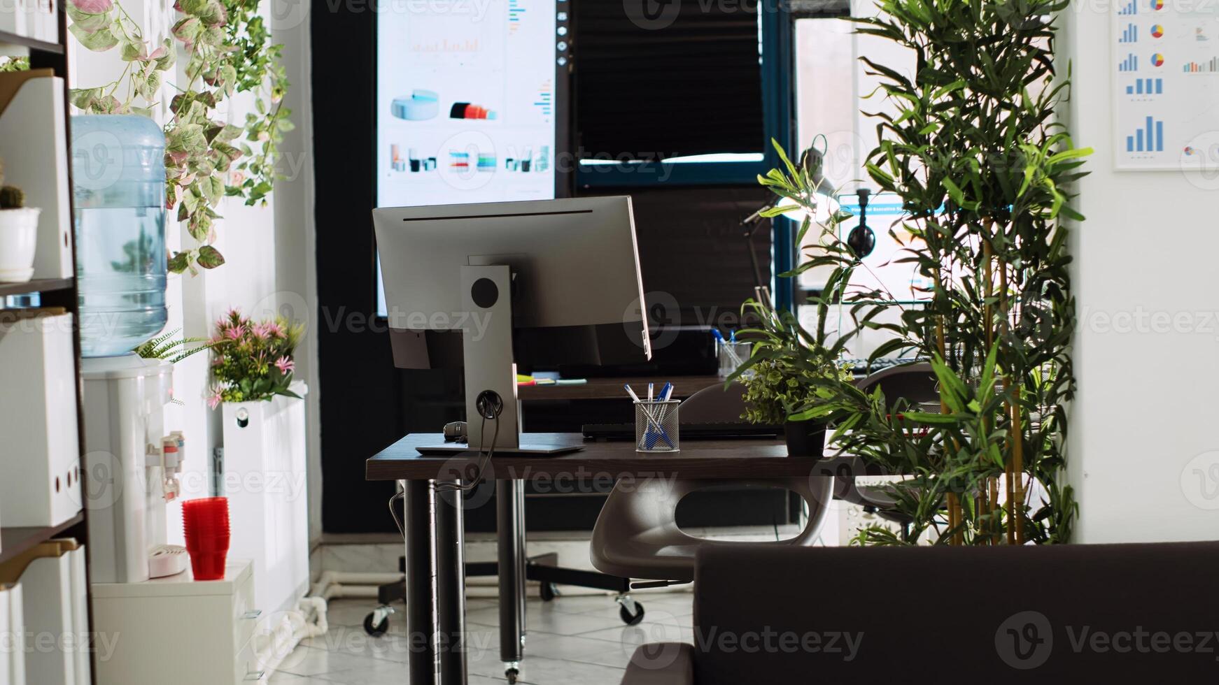 Boardroom office space with desks and stationary tools used for everyday executive tasks in company department place. Empty startup coworking space, small business decorations. photo