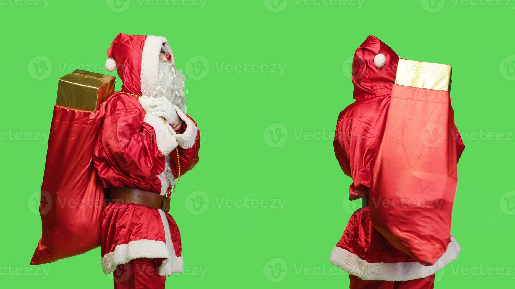 Saint nick waiting for something to give presents and toys from red bag, man dressed like santa claus during seasonal holiday. Young adult in costume carrying sack with many gifts. photo