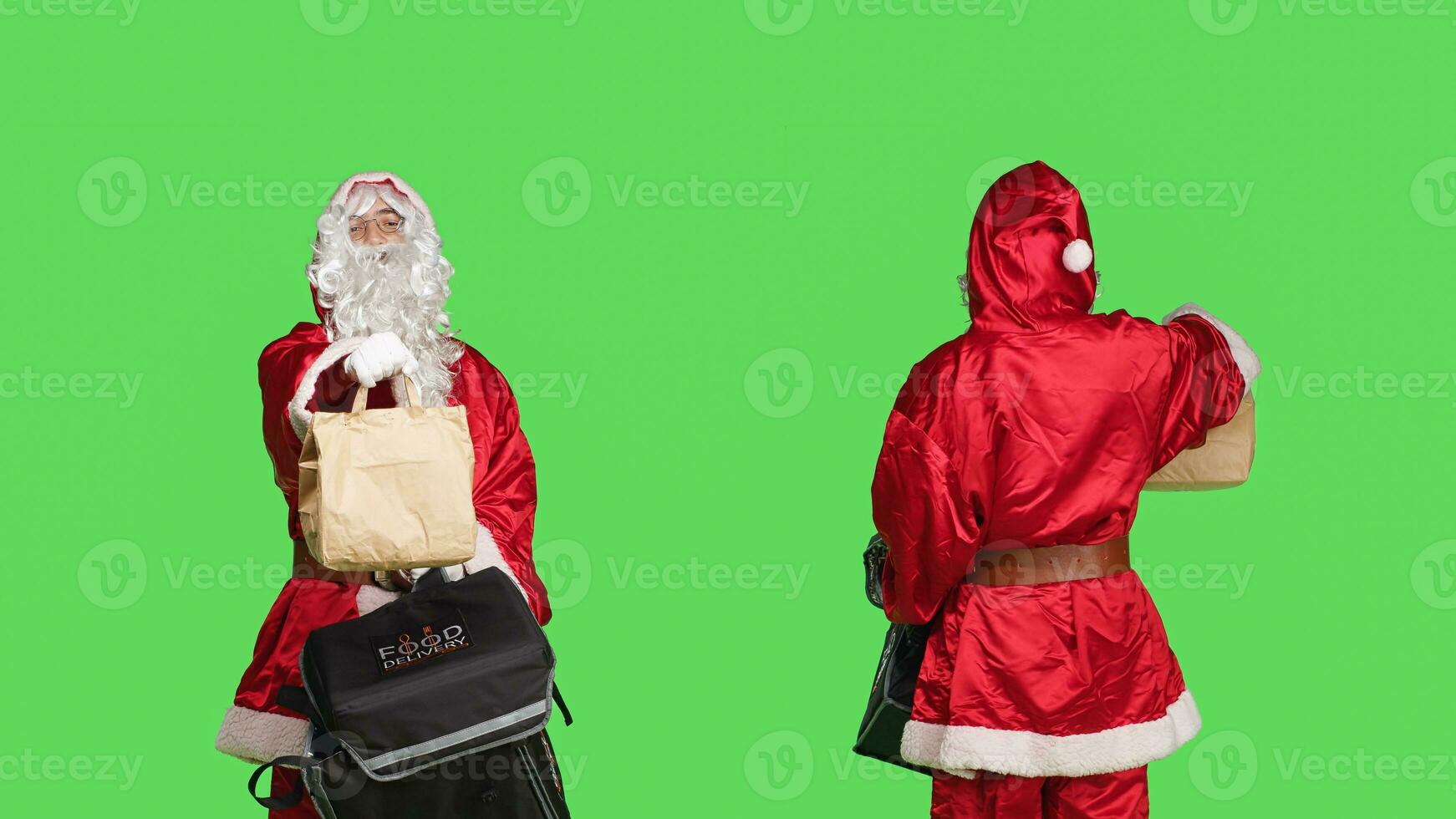 Joyful santa claus person deliver food in paper bag, carrying thermal backpack while he is wearing traditional holiday costume. Man in festive red and white suit, greenscreen backdrop. photo