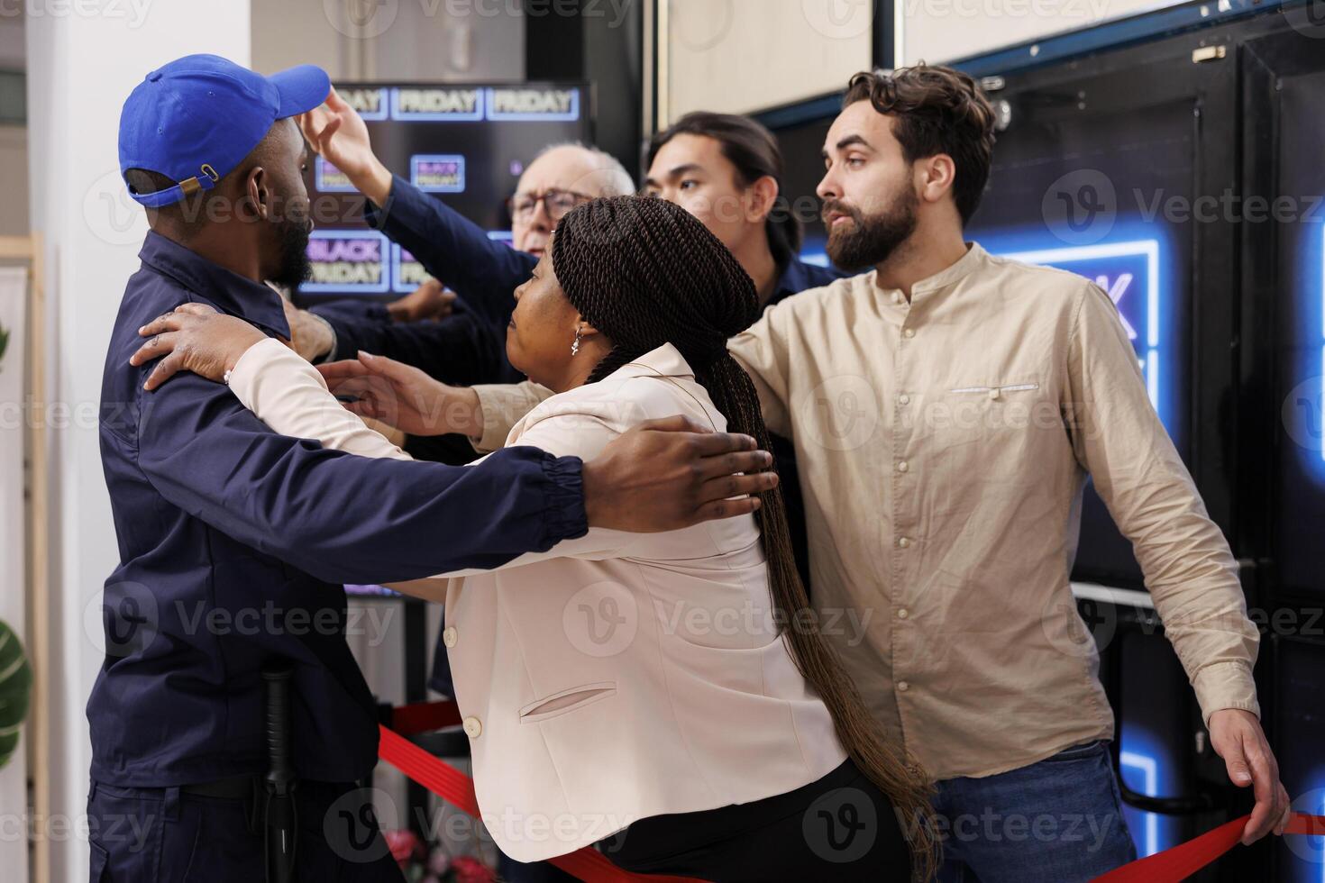 Violent shopping. Fight between security guard and crazy frenzy shoppers at retail store entrance. Aggresive diverse people customers fighting with police while waiting in line for Black Friday sales photo