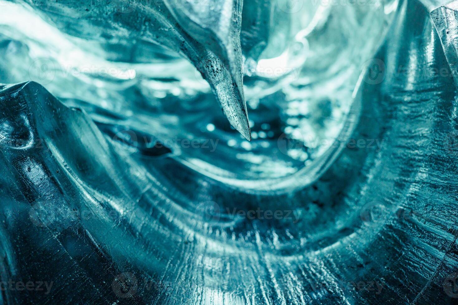 Majestic transparent ice crevasse, blue vatnajokull ice mass with cracks in iceland. Covered frost icy blocks inside wintry glacier structure tunnel, scandinavian nordic landscape. photo