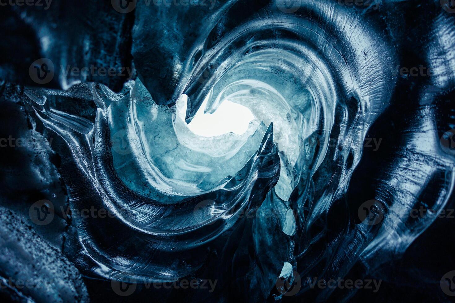 Huge icy blocks inside ice caves, vatnajokull glacier cap with transparent cracked structure in iceland. Iceberg rocks slowly melting in arctic crevasse, covered frost texture in nordic scenery. photo