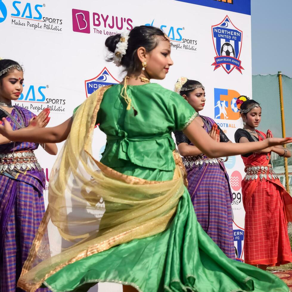 New Delhi, India - July 01 2023 - Bharathanatyam Indian classical odissi dancers performing at stage. Beautiful Indian girl dancers in the posture of Indian dance. Indian classical dance Bharatanatyam photo