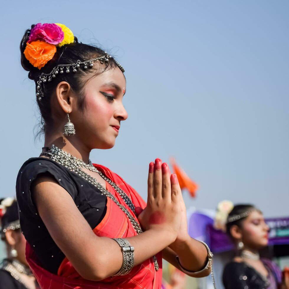 New Delhi, India - July 01 2023 - Bharathanatyam Indian classical odissi dancers performing at stage. Beautiful Indian girl dancers in the posture of Indian dance. Indian classical dance Bharatanatyam photo