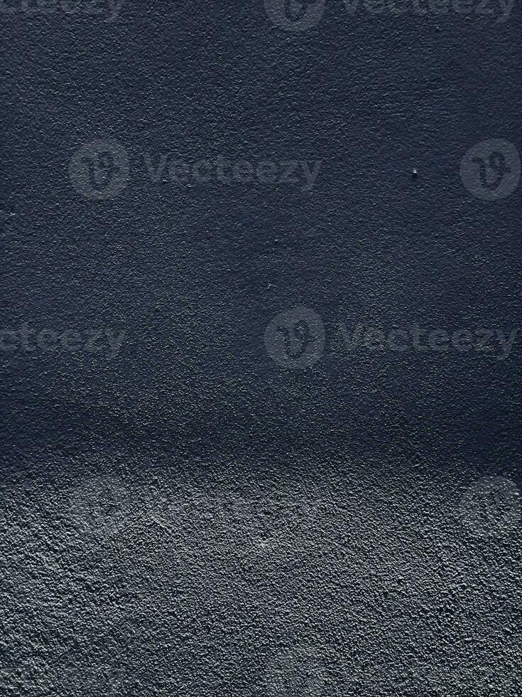 Concrete wall background in dark tones photo