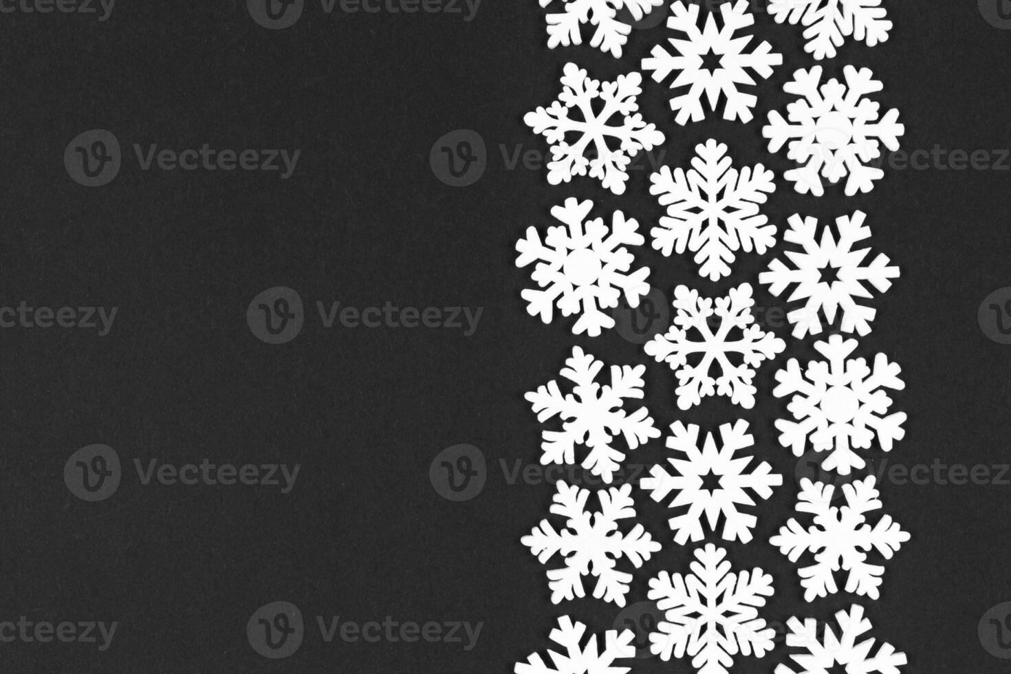 Top view of white snowflakes on colorful background. Winter weather concept with copy space. Merry Christmas concept photo