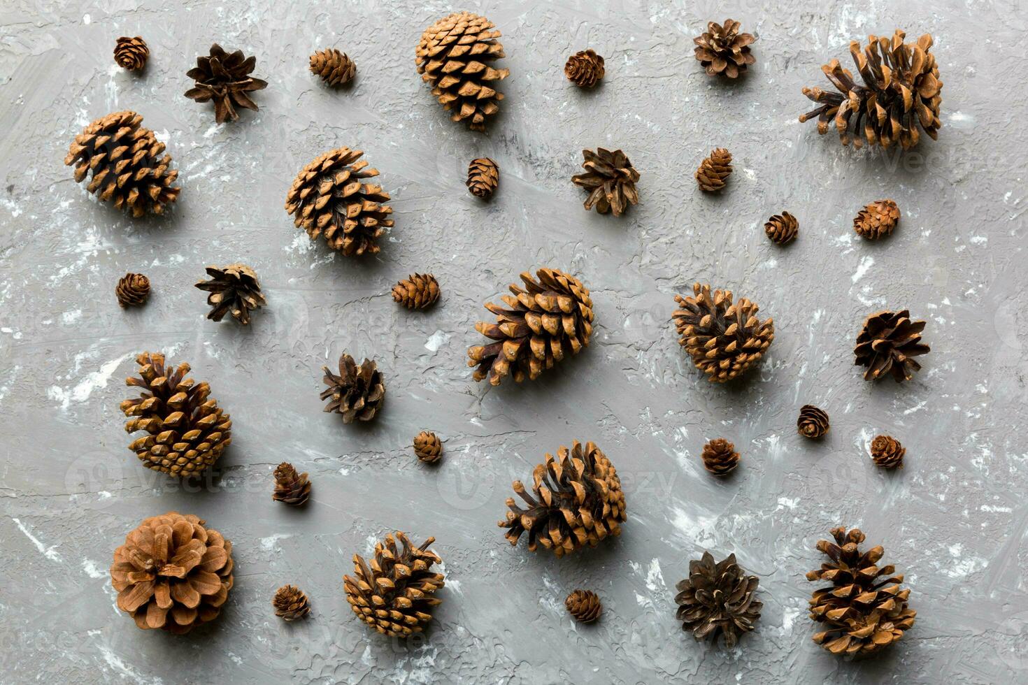 pine cones on colored table. natural holiday background with pinecones grouped together. Flat lay. Winter concept photo