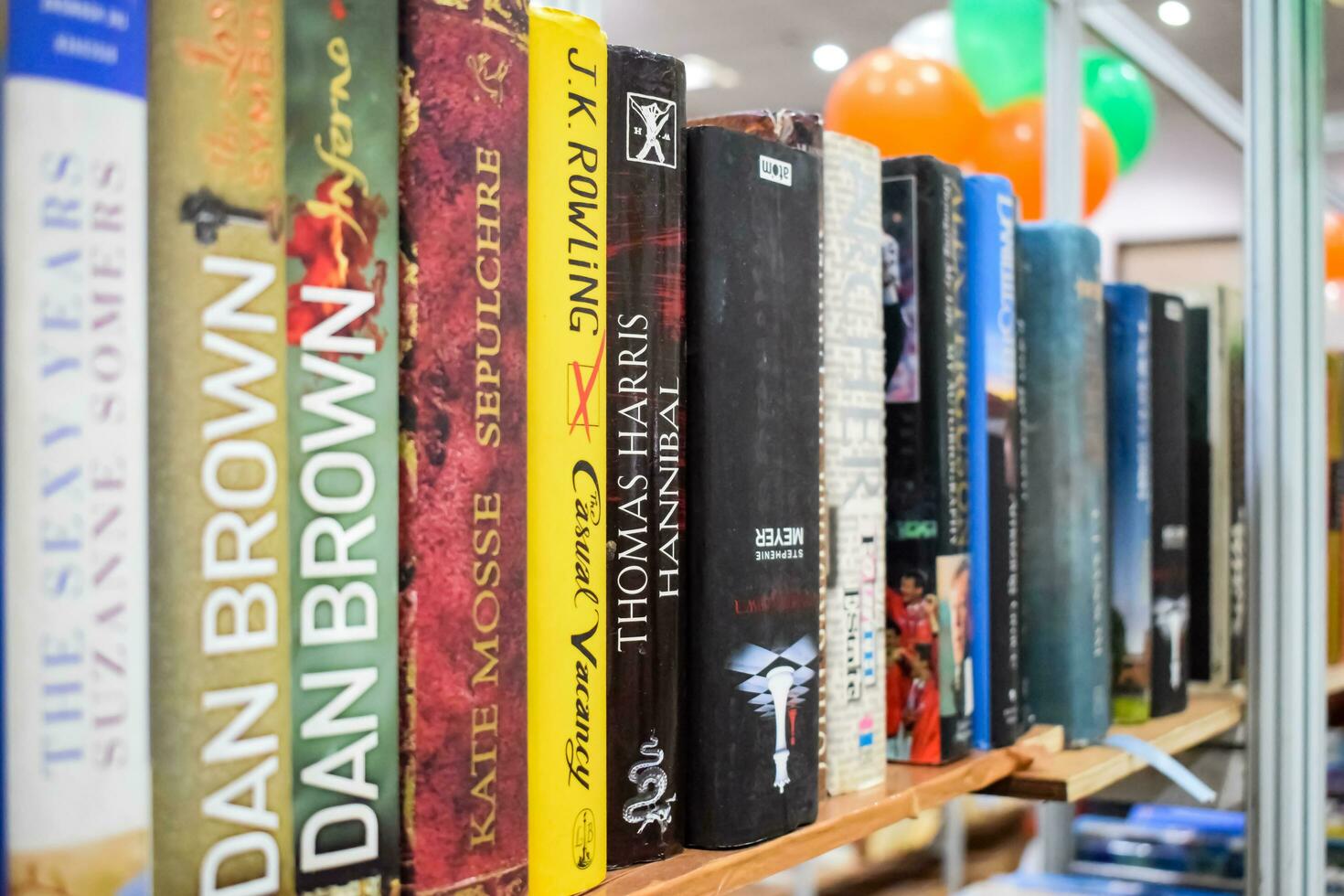 New Delhi, India, September 09 2023 - Variety of Books on shelf inside a book-stall at Delhi International Book Fair, Selection of books on display in Annual Book Fair. photo