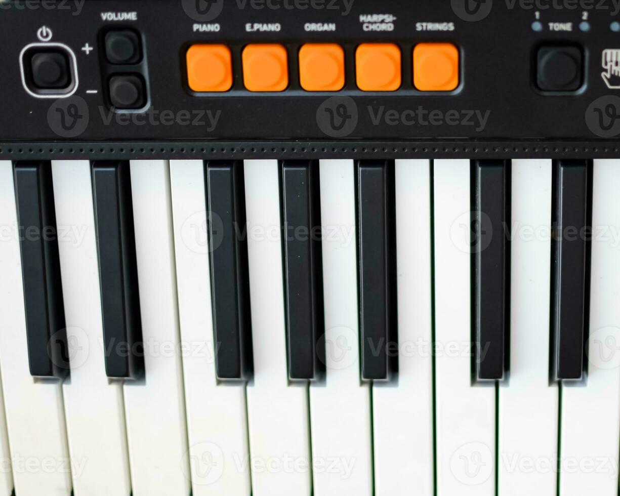 Close-up of piano keys. Piano black and white keys and Piano keyboard musical instrument placed at the home balcony during sunny day. photo