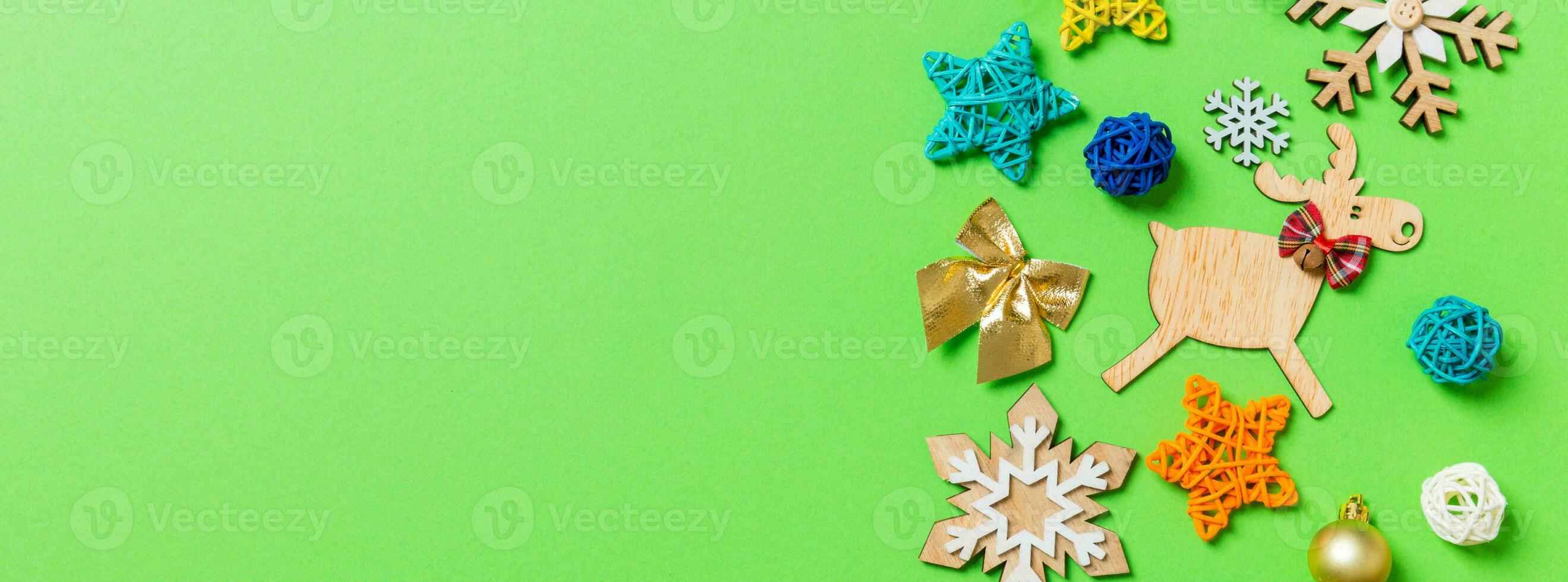 Top view Banner of green background with New Year toys and decorations. Christmas time concept with copy space photo
