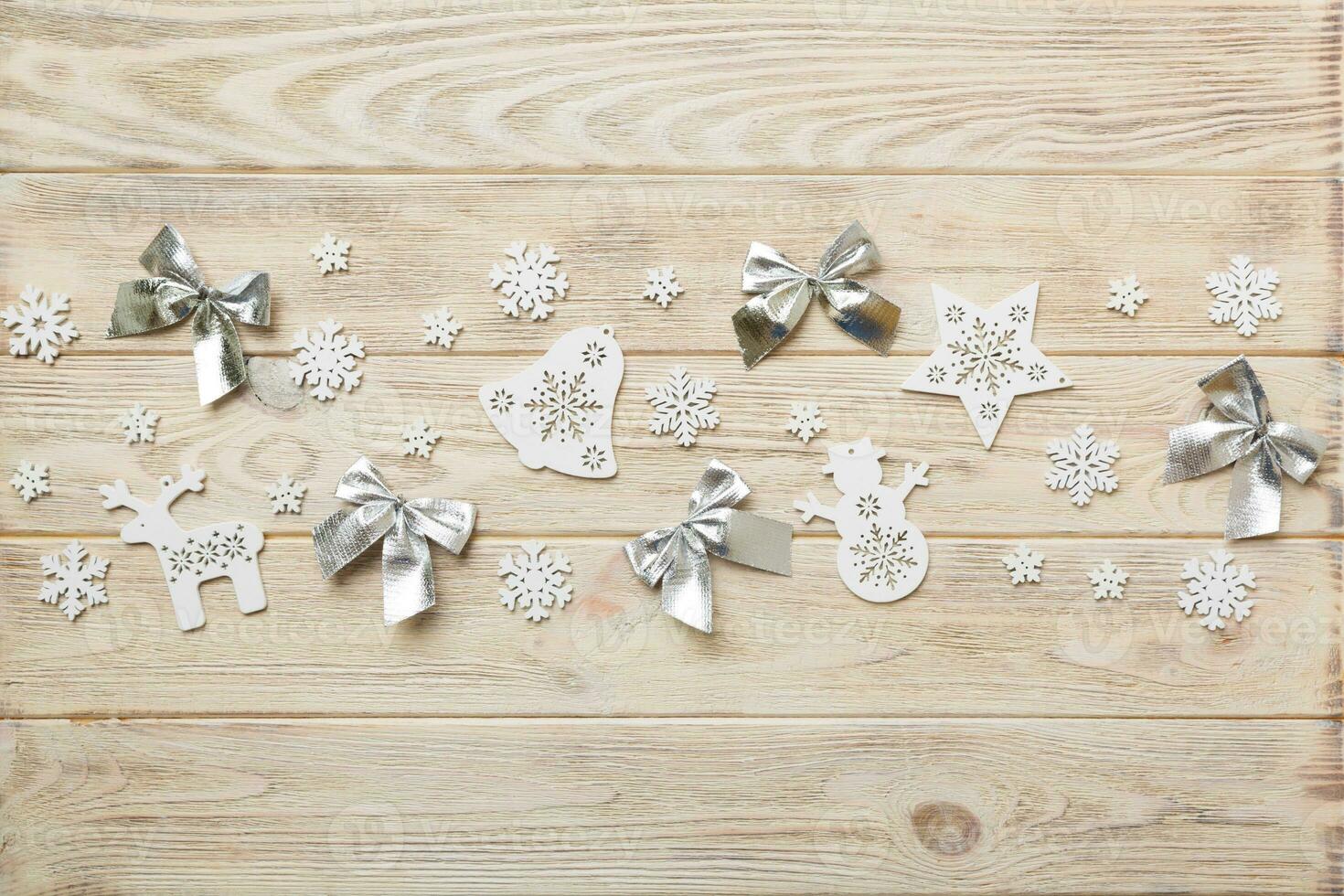 New Year composition white christmas snowflakes. Christmas decor background with pine cones. Top view with copy space photo