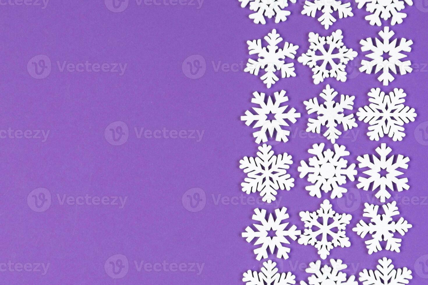 Set of white snowflakes on colorful background. Top view of Christmas ornament. New Year time concept with empty space for your design photo