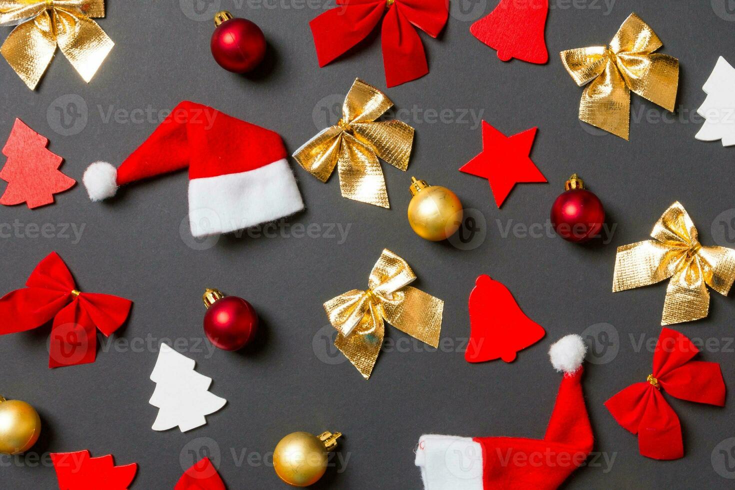 Top view of black background with New Year toys and decorations. Christmas time concept photo