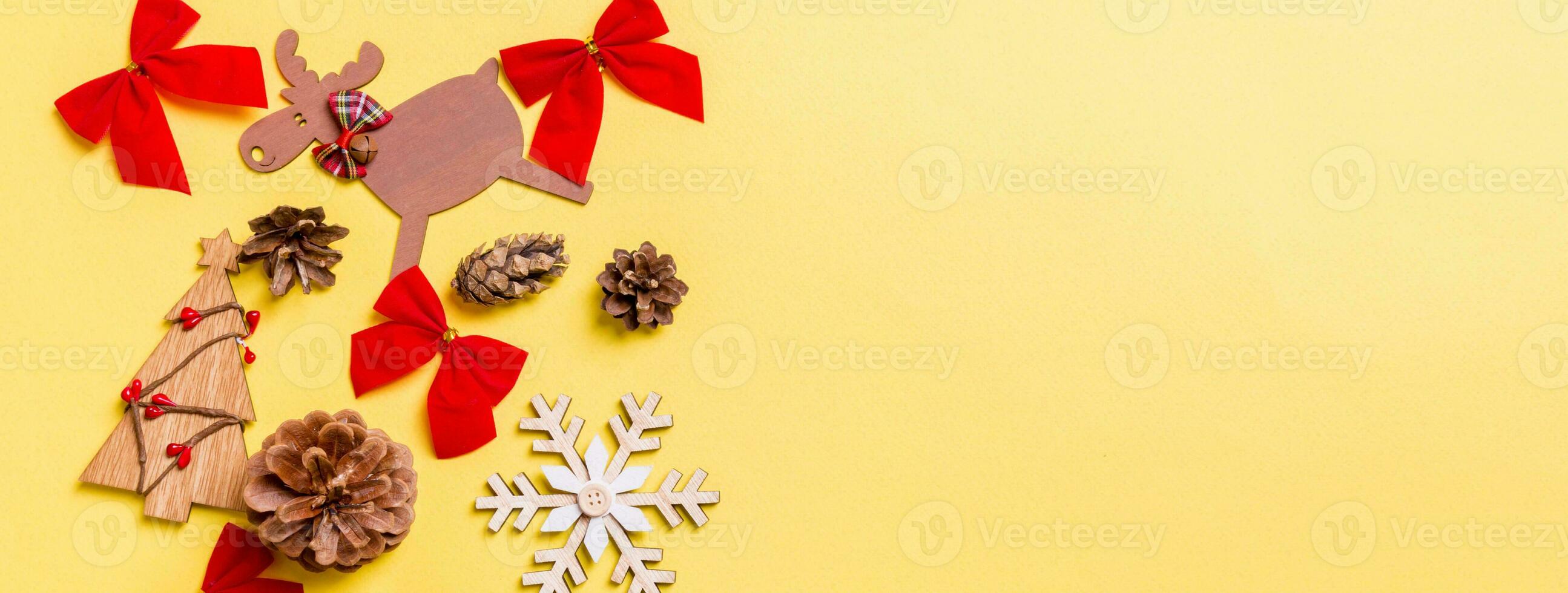 Christmas yellow background with holiday toys and decorations. Banner Happy New Year concept with empty space for your design photo
