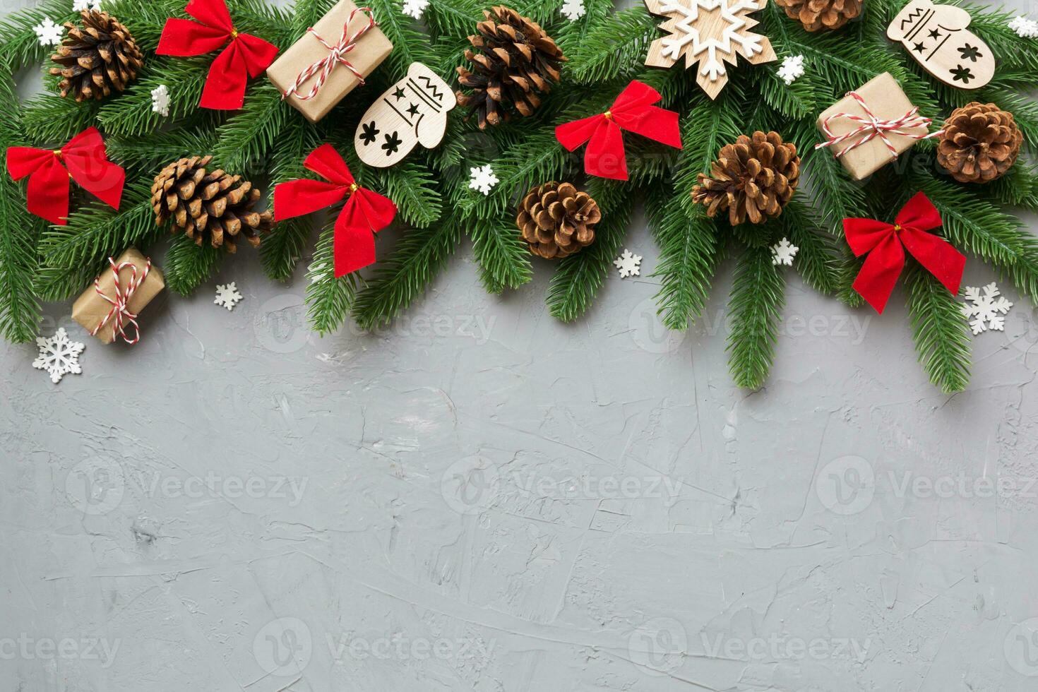 Christmas decorations and fir tree branch and gift boxon dark table. Top view frame with copy space photo
