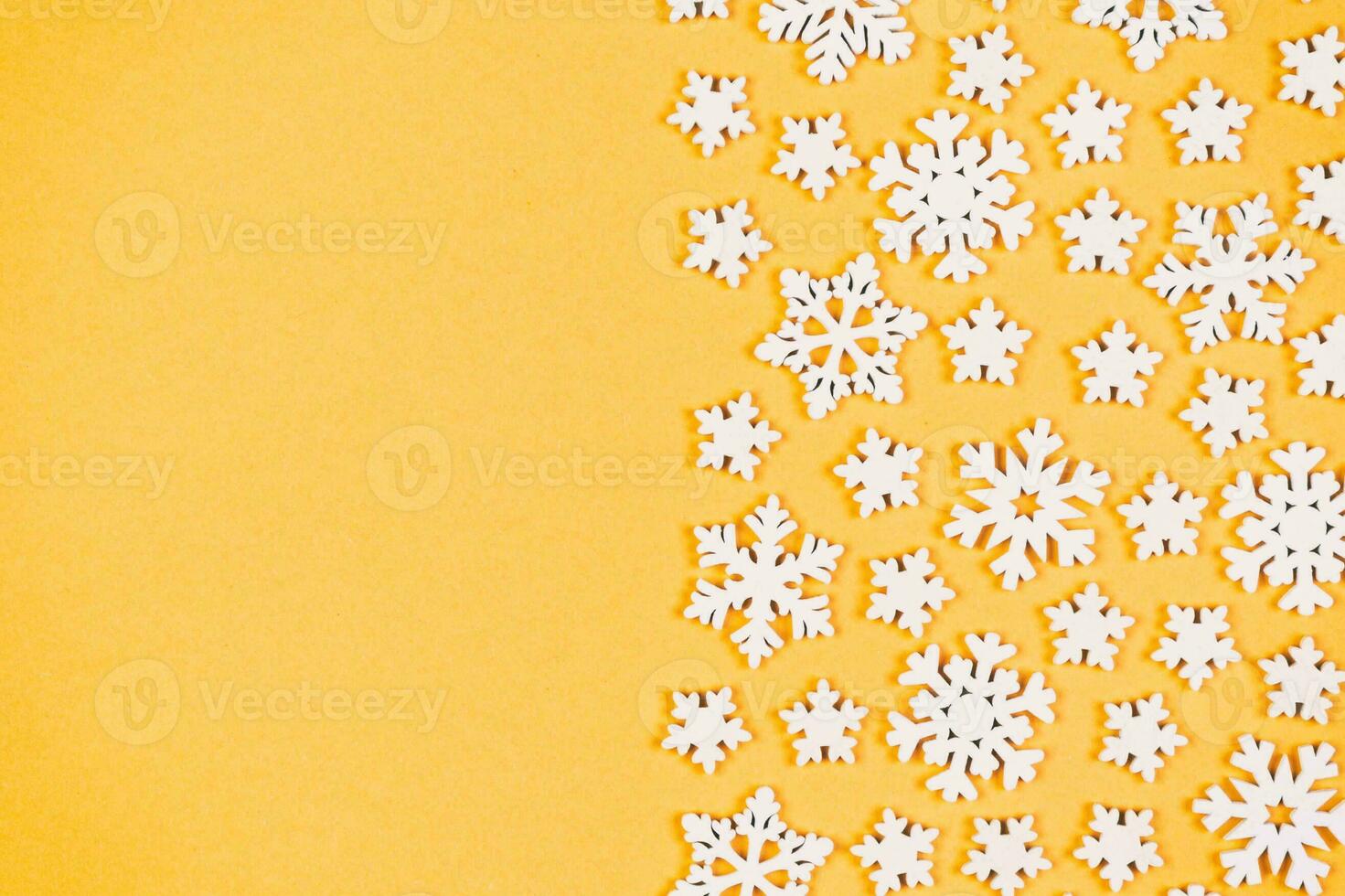 Top view of winter ornament made of white snowflakes on colorful background. Happy New Year concept with copy space photo