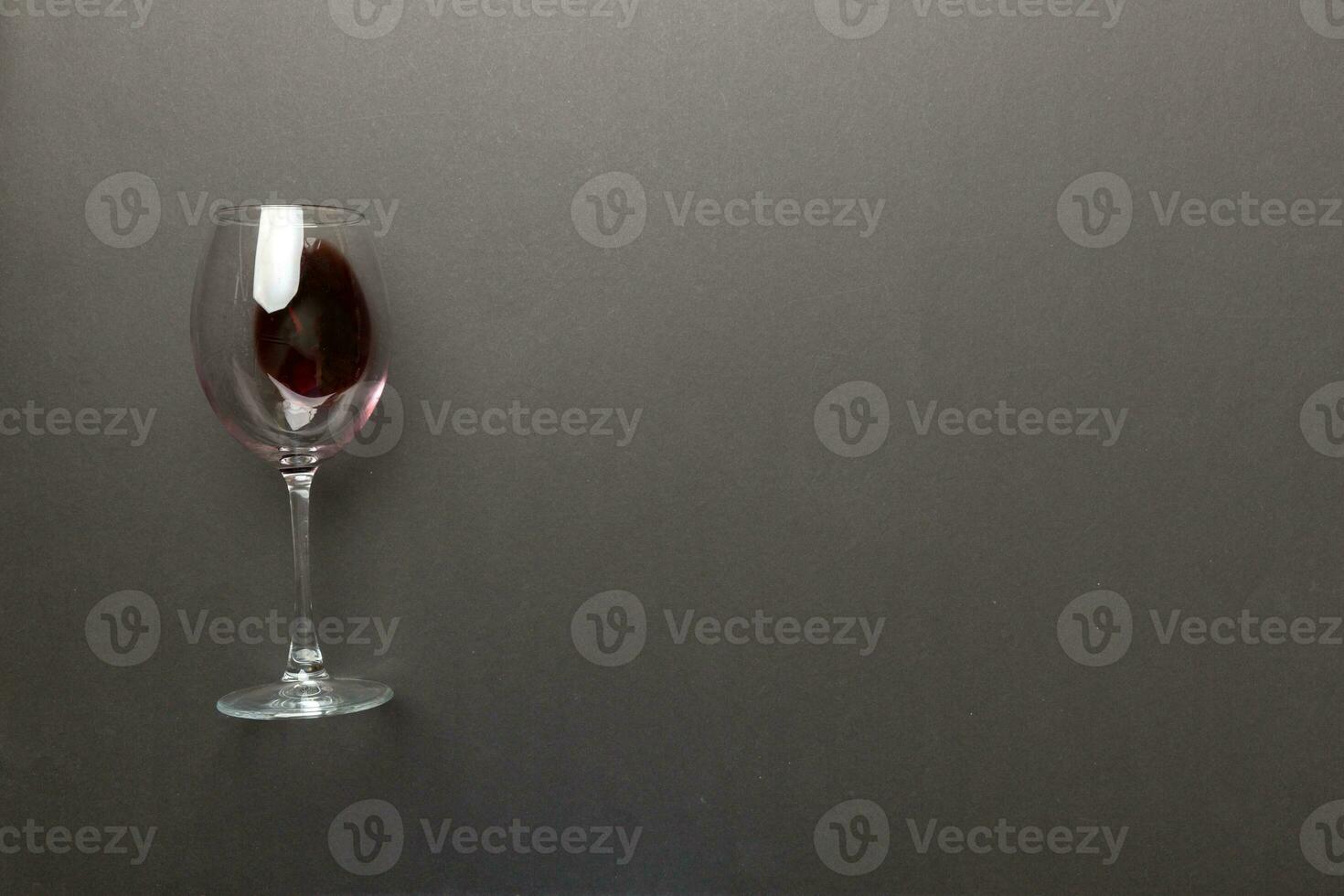 One glasses of red wine at wine tasting. Concept of red wine on colored background. Top view, flat lay design photo