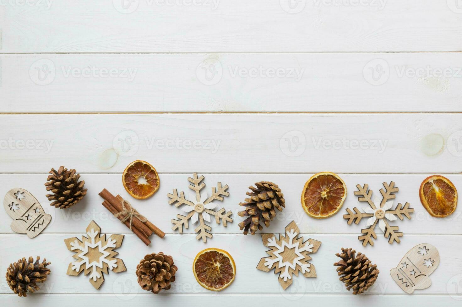 New Year composition. Christmas decor background with pine cones. Top view with copy space photo