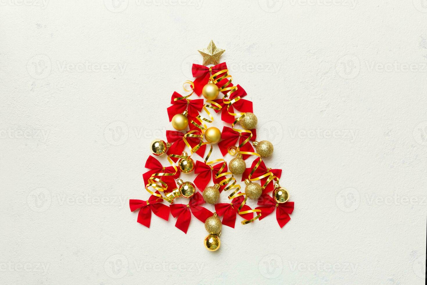 Christmas tree made from colored ball decoration on colored background, view from above. New Year minimal concept with copy space photo