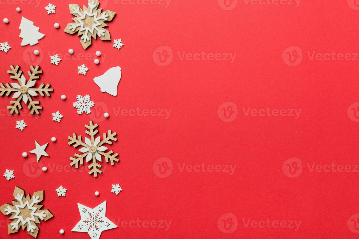 New Year composition white christmas snowflakes. Christmas decor background with pine cones. Top view with copy space photo