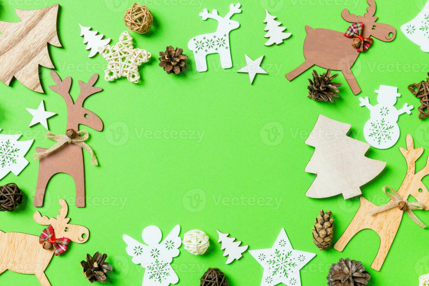 Christmas green background with holiday toys and decorations. Happy New Year concept with empty space for your design photo